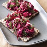 Herring beet apple salad on rye crisps scandinavian